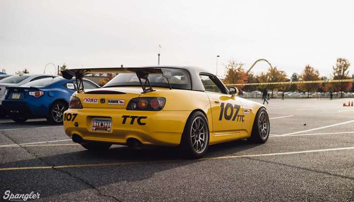 Yellow Honda S2000 with racing decals at autocross event