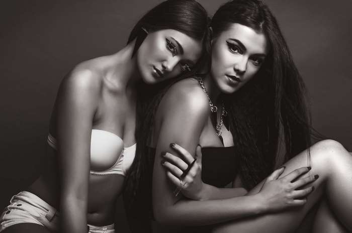 Two female models in a black and white photoshoot