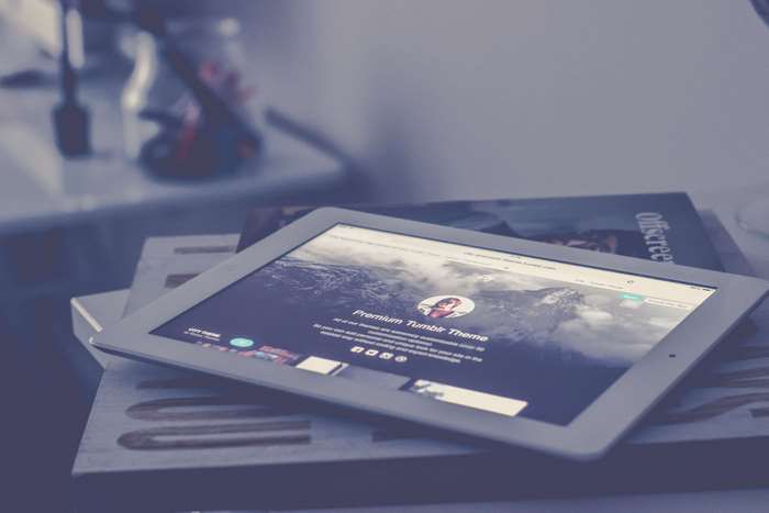 iPad displaying Premium Tumblr Theme with mountain background