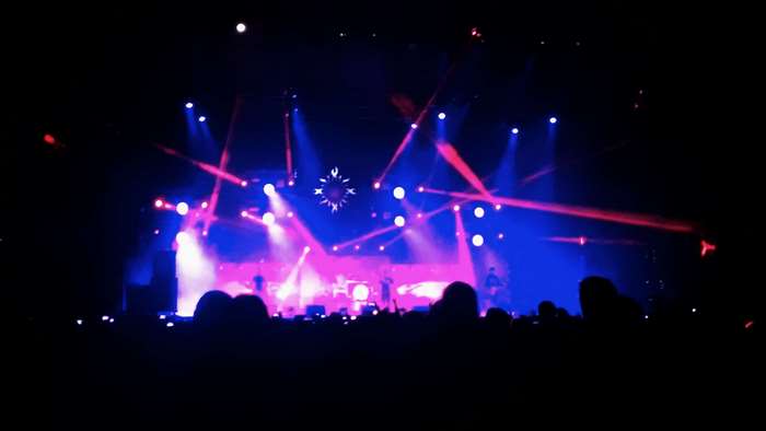 Godsmack concert stage with blue and pink lights 4K
