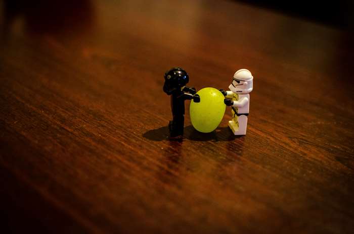 Lego Stormtrooper and black figure with grape