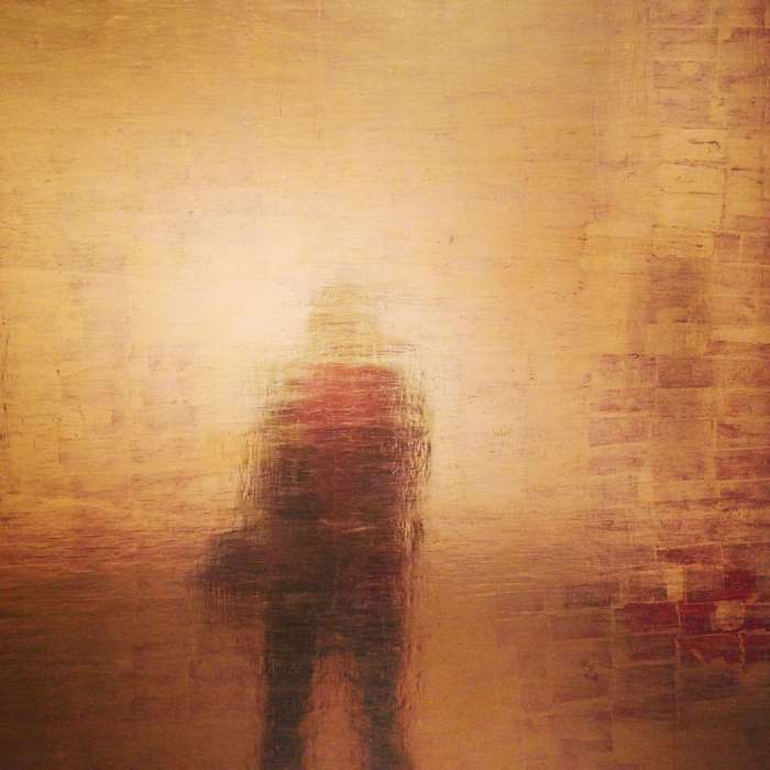 Abstract portrait of a person in gold and red