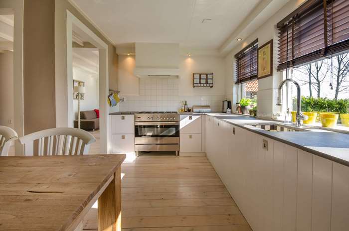 Modern kitchen with wooden table and chairs