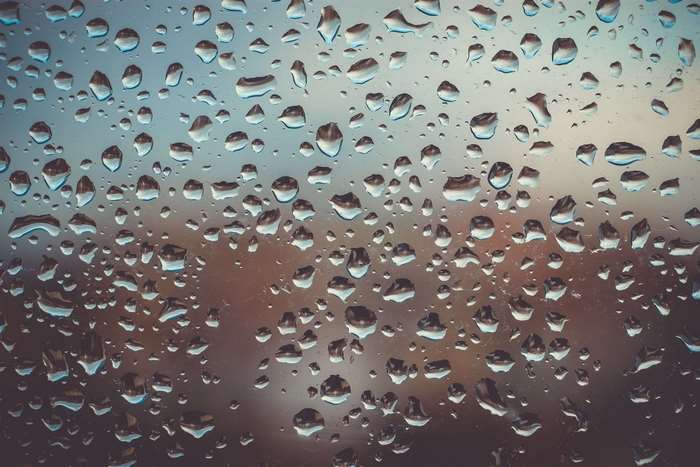 Raindrops on glass surface texture 4K