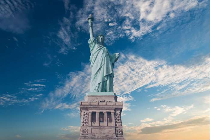 Statue of Liberty in New York City against a cloudy sky