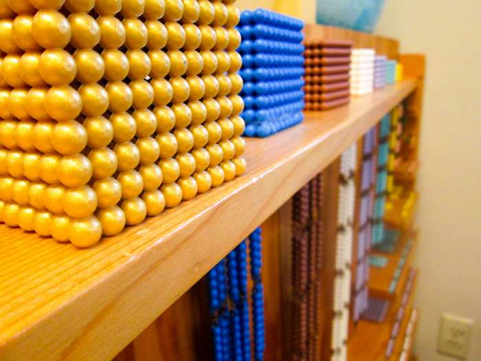 Montessori math beads and learning materials on shelves