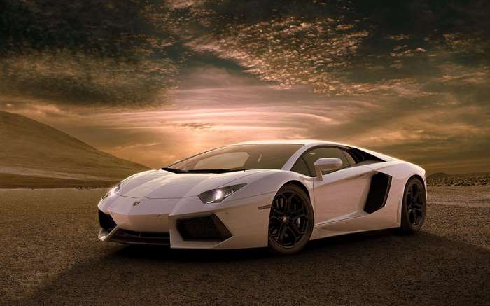 White Lamborghini Aventador on a dirt road at sunset