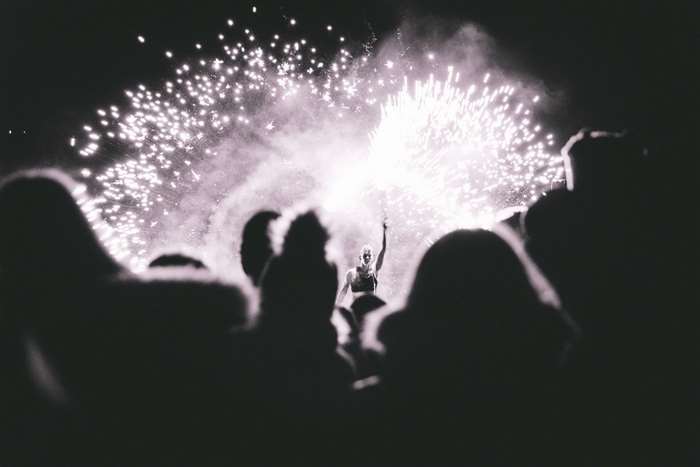 Performer with fireworks and audience