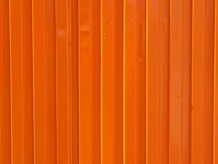 Orange corrugated metal surface