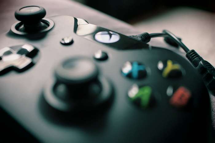 Close up of an Xbox controller with a cable