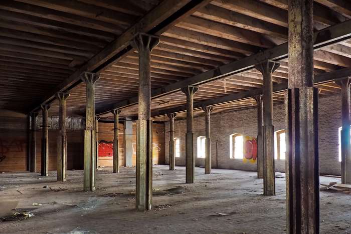 Abandoned industrial hall with graffiti