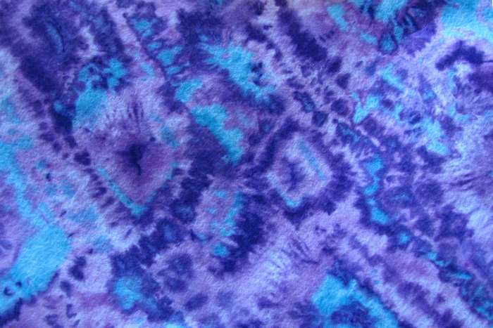 Abstract tie-dye pattern with purple and blue colors