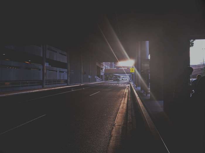 Street under a bridge with sunset light