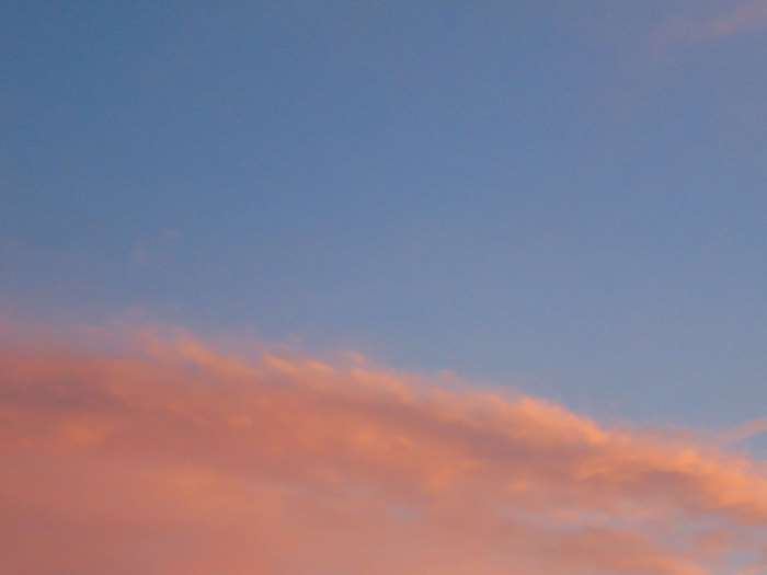 Pink clouds in a blue sky at sunset 4K