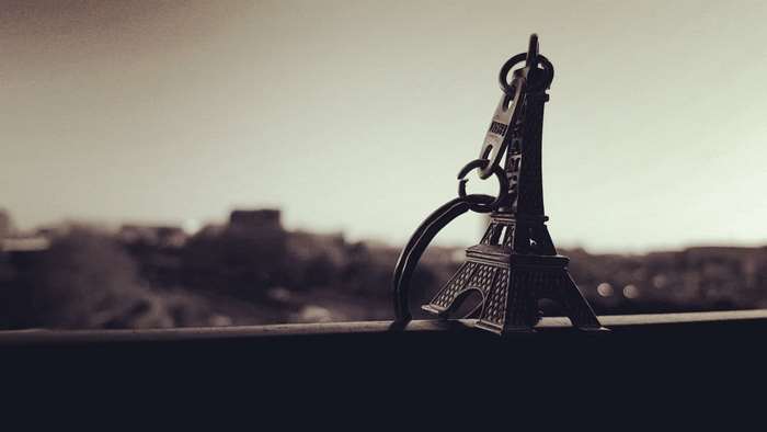 Eiffel Tower keychain on a railing
