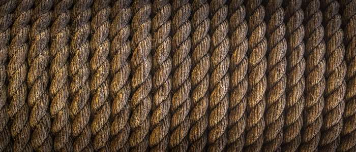 Close-up texture of a thick, brown, twisted rope