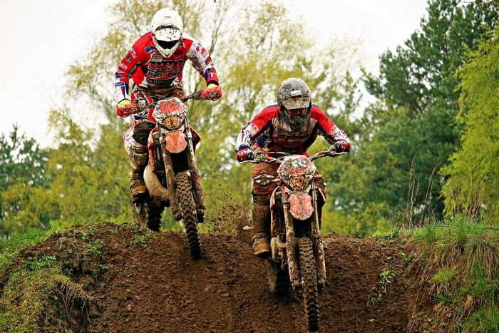 Motocross riders racing on a dirt track