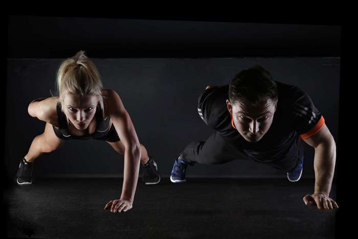 Man and woman doing push-ups