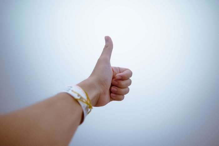 Hand giving thumbs up gesture