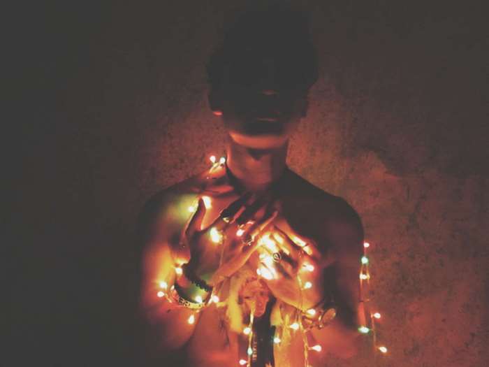 Man wrapped in fairy lights