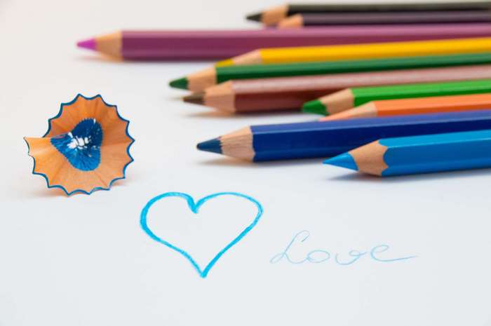 Colored pencils and a heart drawing