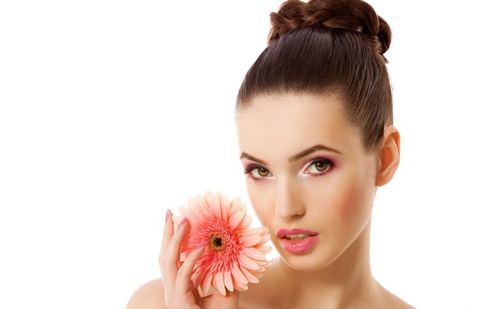 Elegant Brunette Woman Holding Pink Flower