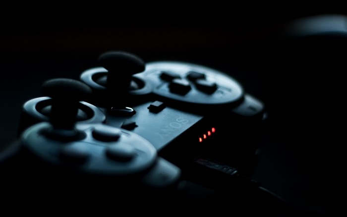 Sony PlayStation controller with red indicator lights