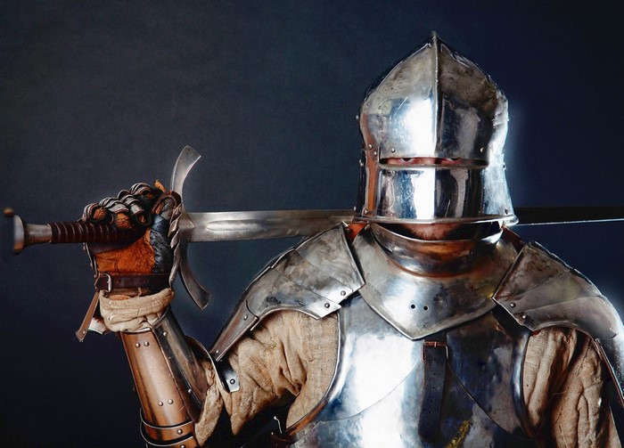 Knight in full armor holding a sword