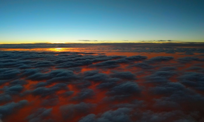 Sunset over clouds from airplane