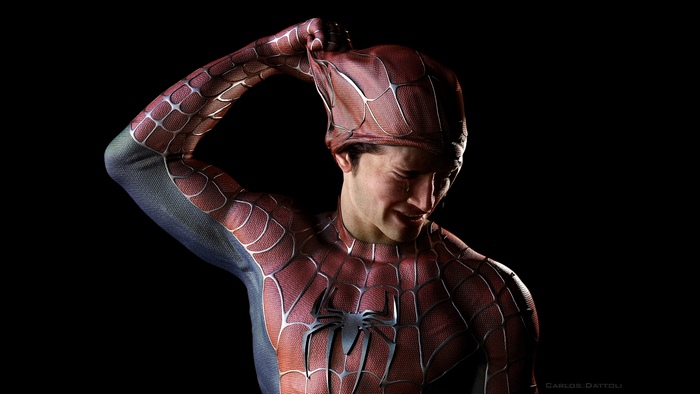 Spider-Man crying and pulling off mask