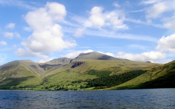Lake and Mountains under a Cloudy Sky