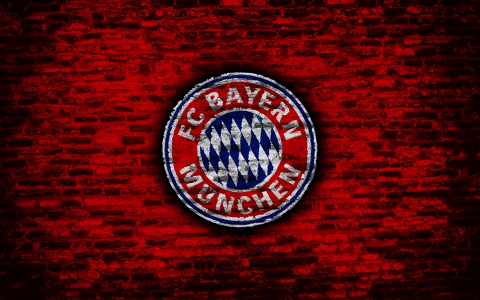 FC Bayern Munich logo on red brick wall