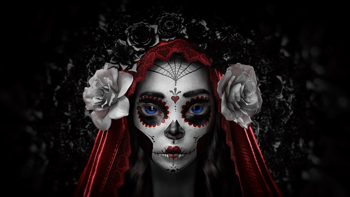 Girl with Sugar Skull face paint and blue eyes