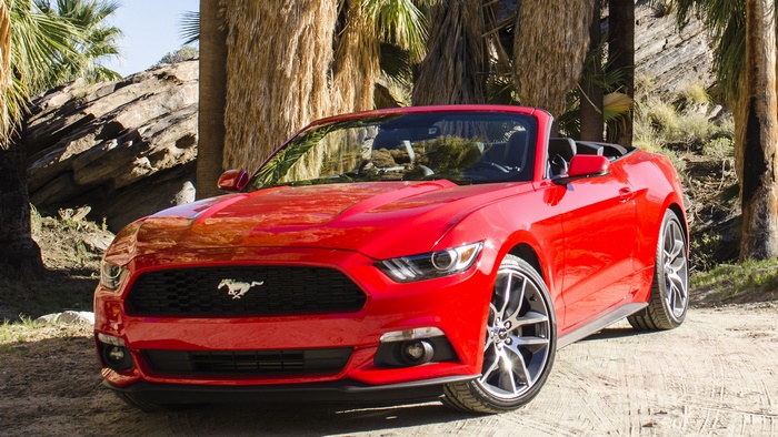 Red Ford Mustang Convertible in Desert Landscape