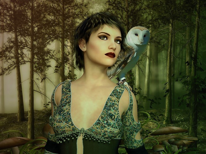 Fantasy woman with owl in a forest