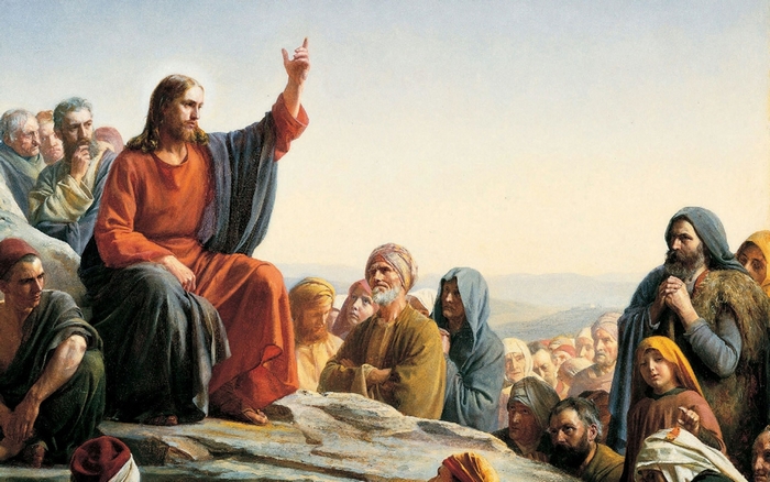 Jesus preaching to a crowd on a hill