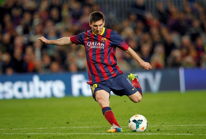 Lionel Messi Kicking Soccer Ball in Action