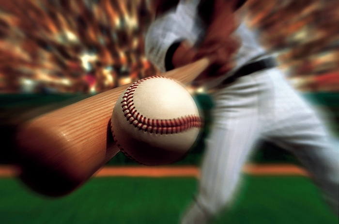 Baseball game in progress with stadium crowd