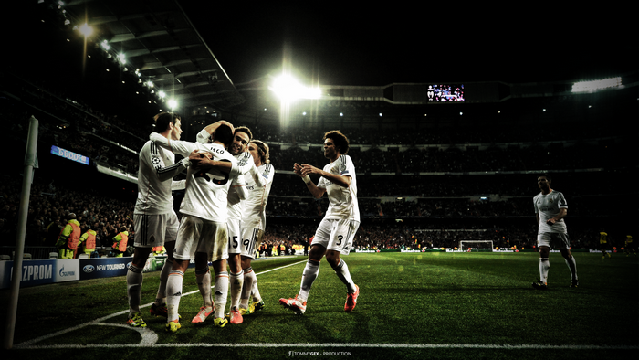 Real Madrid Players Celebrating on Football Field