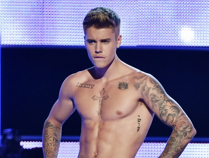 Justin Bieber Shirtless with Tattoos on Stage