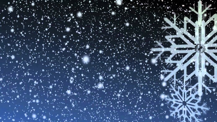 Snowflakes falling on a dark blue background