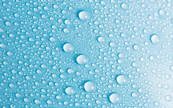 Water droplets on a blue surface