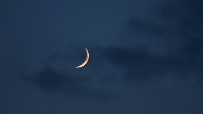 Crescent moon in the night sky
