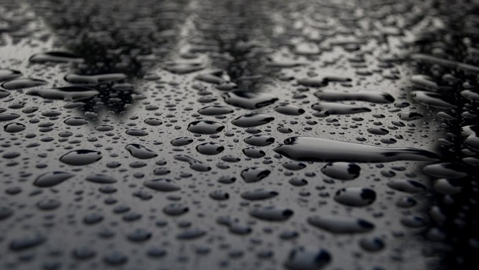Raindrops on a dark surface