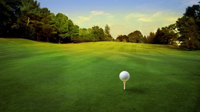 Golf ball on a tee on a golf course