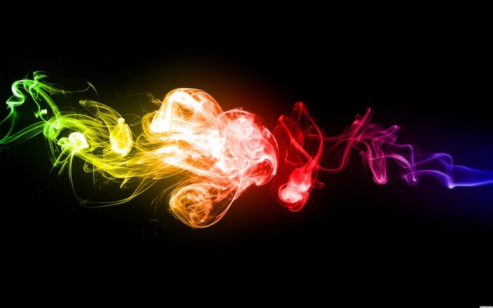 Colorful smoke trails on black background