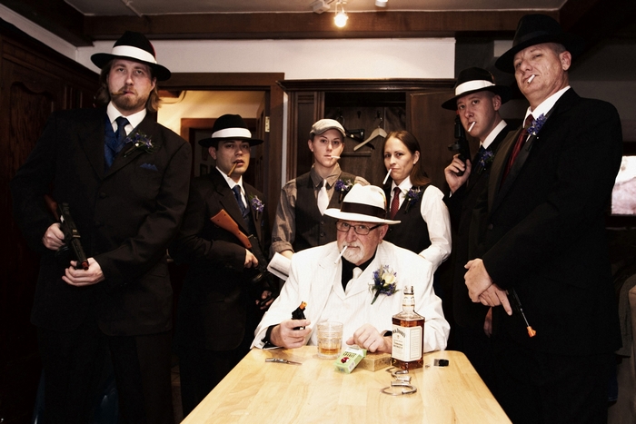 Gangsters in suits with guns and cigarettes