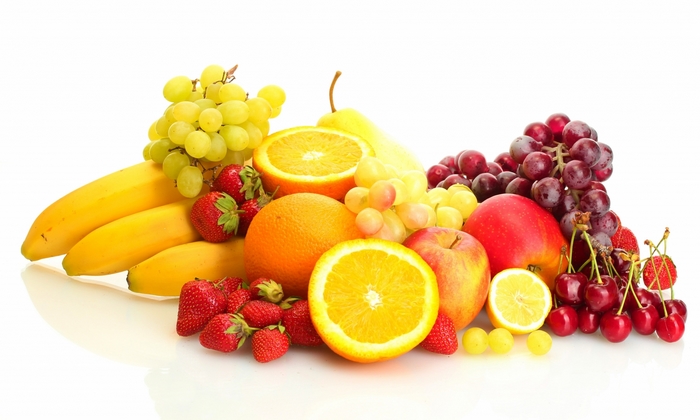 Assortment of fresh fruits including bananas, strawberries, oranges, grapes, apples, and cherries