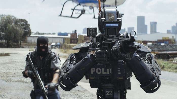 Chappie robot and man with gun