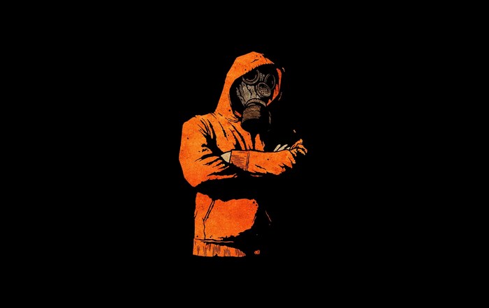 Person in orange hoodie and gas mask